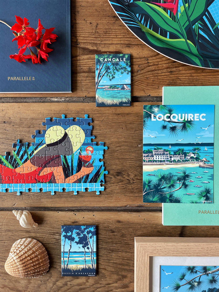 Différents produits (carnets, carte postale, puzzle, magnets) représentant l'été au bord de l'eau