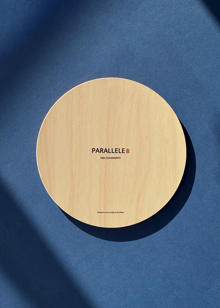 Dessous de plat avec l'illustration d'un homard bleu sur fond rose