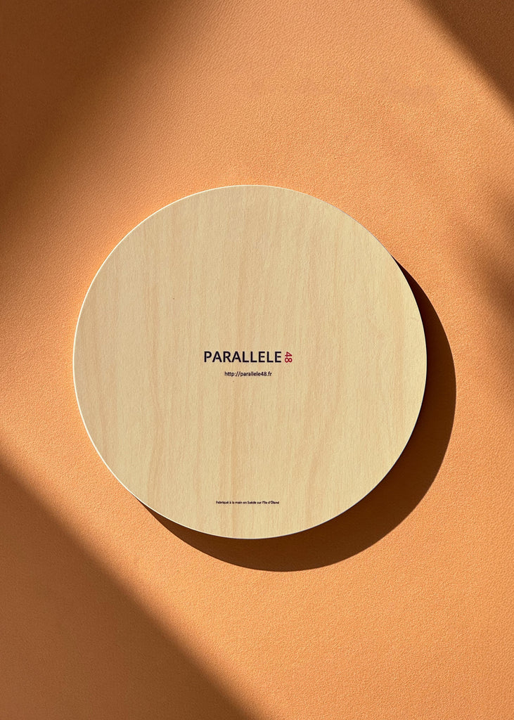 Dessous de plat en bois avec un dessin du saint-pierre